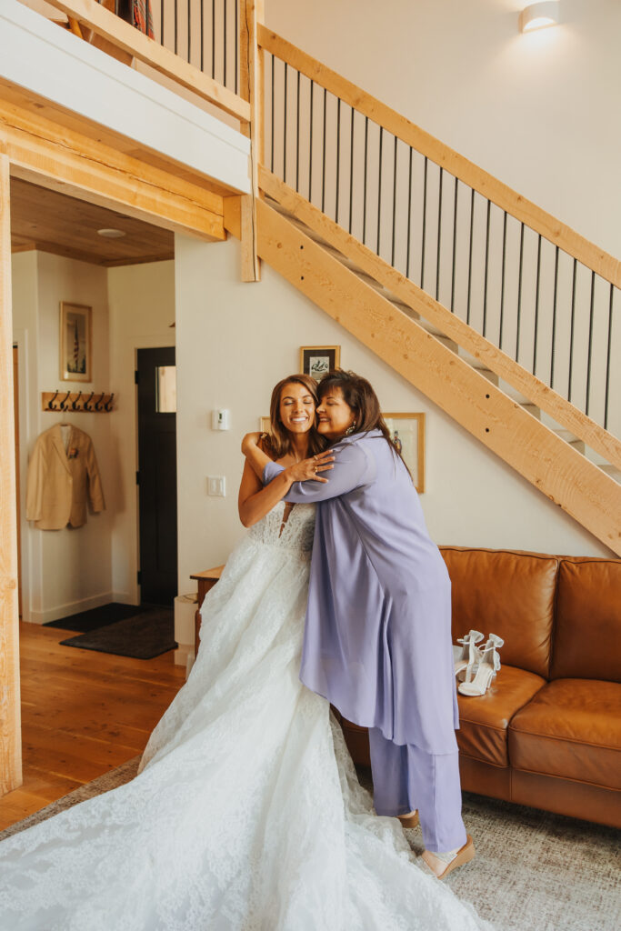 Mother and daughter embrace on wedding day
