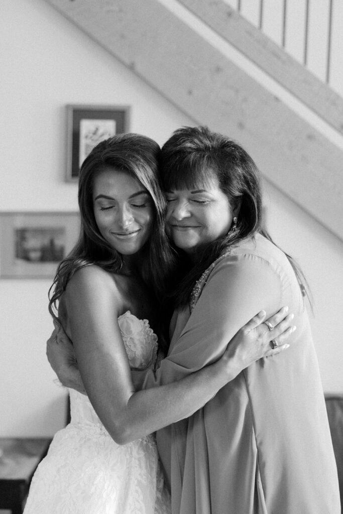 mother and daughter embracing before her wedding day