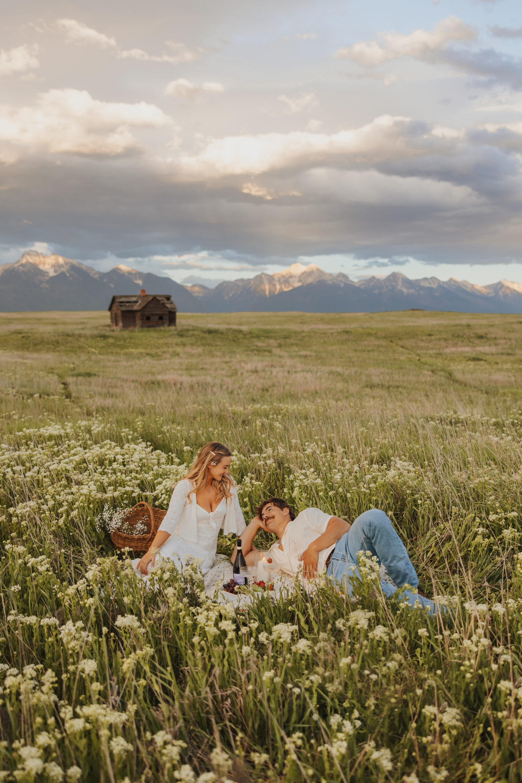 Romantic Picnic in a wildflower field beneath the mission mountains