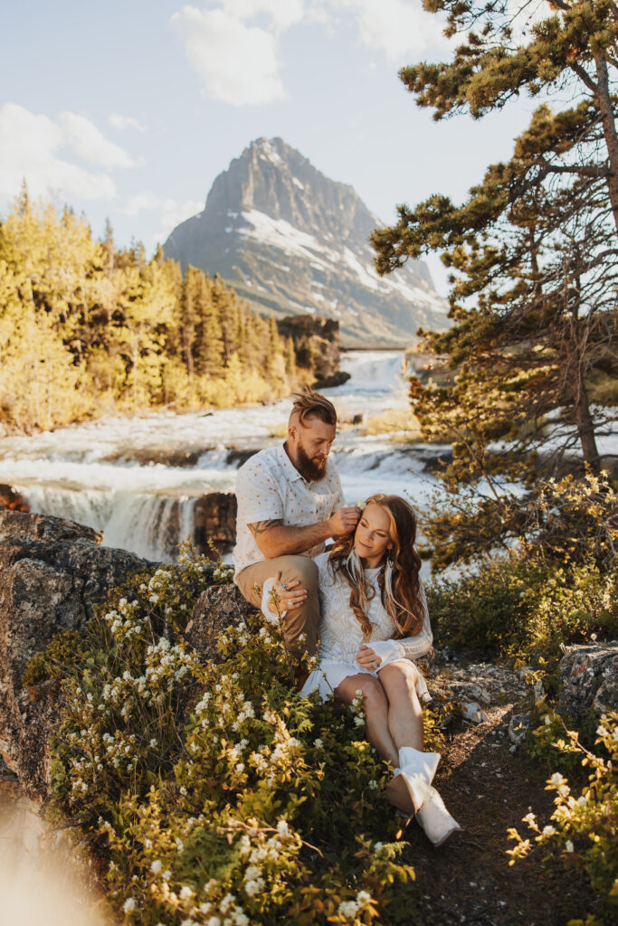 Couple near swiftcurrent falls Glacier National park