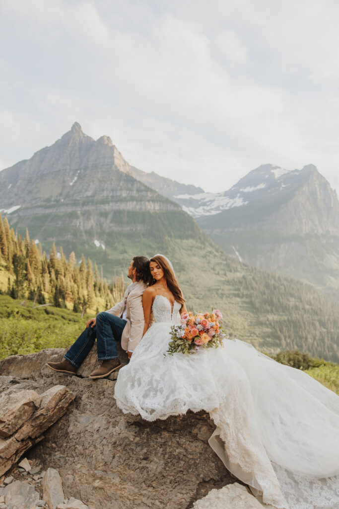Bride and groom back to back in glacier park