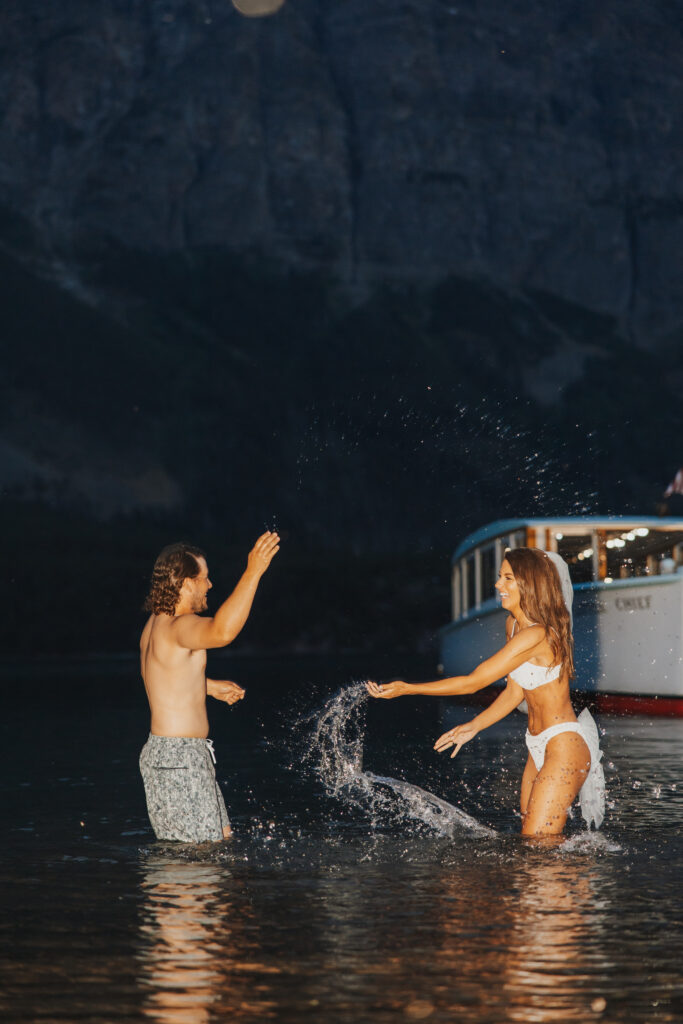 Bride and groom late night swim splash