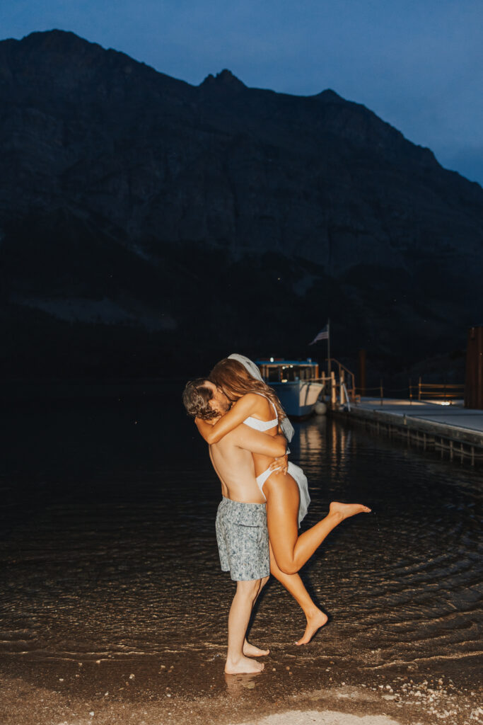 Bride and groom late night swim kiss
